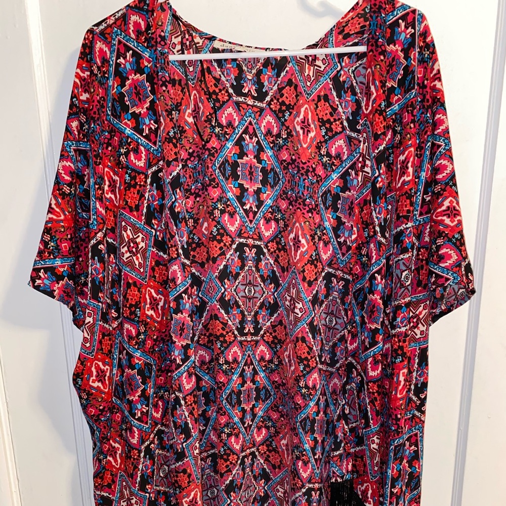 Pink kimono with black fringe